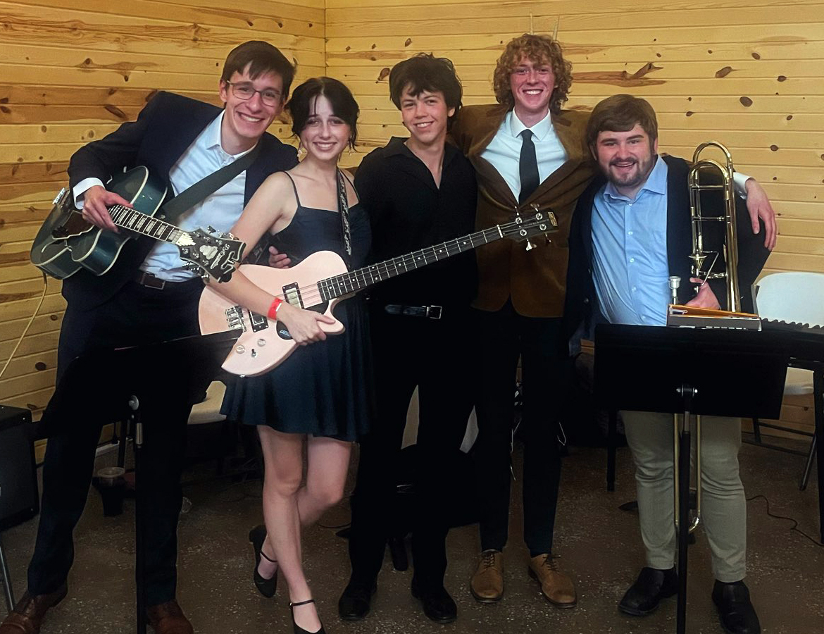 Nicolaas tenBroek, Grace Carr, Eli Myzer, Henry Burns and Tim Kasprzak pose after the combo performance at Campus Activity Board’s Casino Night in Fall 2024. 