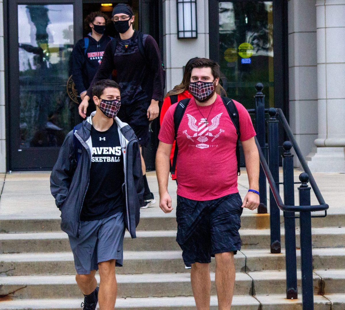 Matt Conner, left, and Connor Muehler walk through the quad wearing their masks on Monday, August 31st. Photo by Liam Keating