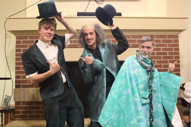 Noah Steenbergen, John Cybulski, and Scotty Smeltzer all pose as the Hitchiking Ghosts from Disney’s Haunted Mansion. -Photo taken by Ian Milton