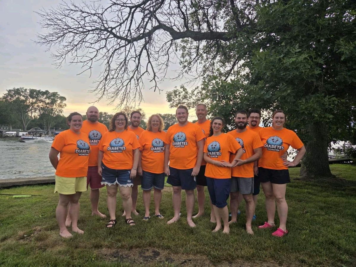 Family and friends pose with Dominick in "Diabetes Monster" t-shirts. Photo courtesy of Anthony Dominick.