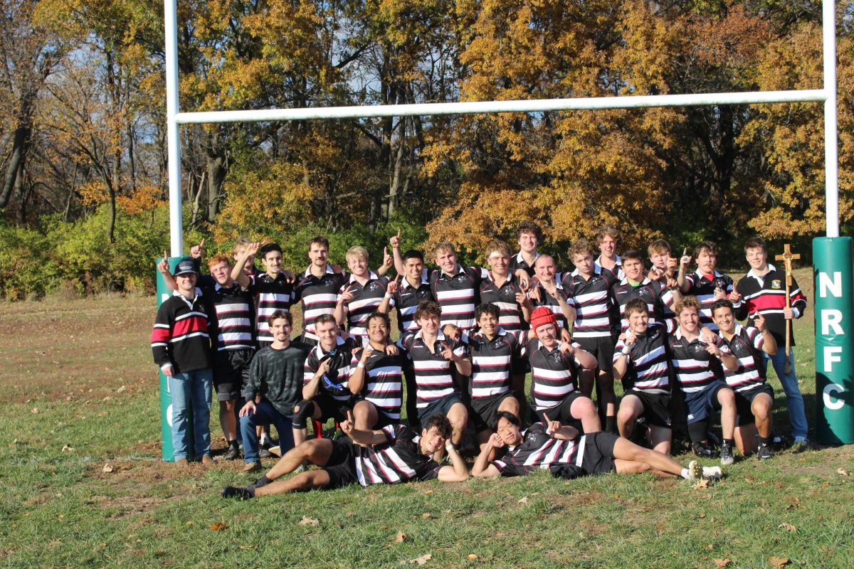 The Black Monks rugby team gathers for a team photo. Courtesy of Gabriel Green.