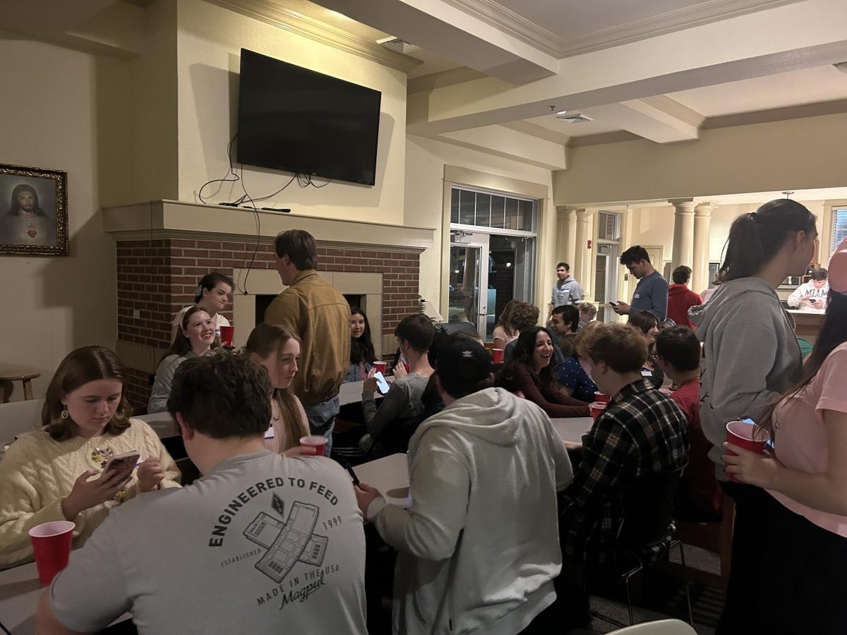 Students engage in electric conversation in Legacy Lounge as Speed Dating wraps up for the evening.
